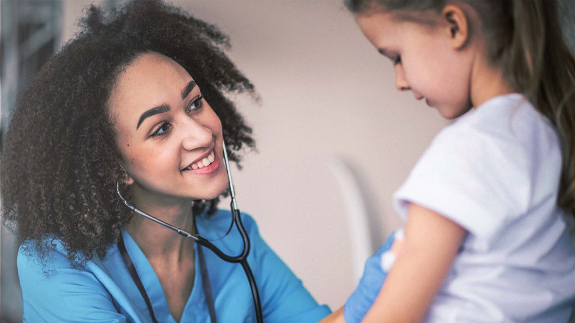School nurse helping a child with a bleeding disorder at school